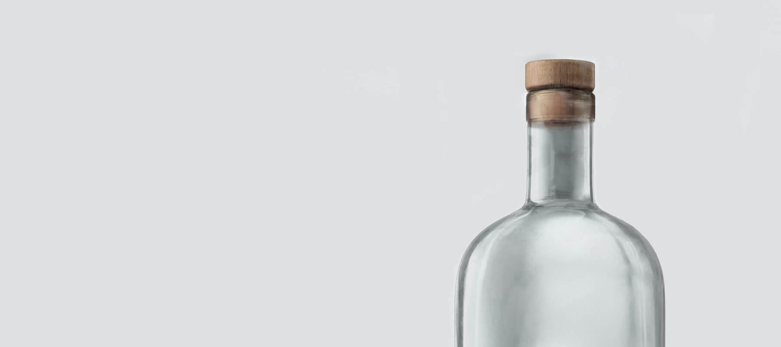 eine weiße Olivenoel Flasche mit braunem Korkverschluss